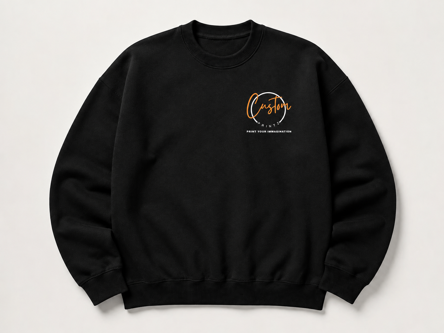 Black custom crewneck sweatshirt with the Customprintz logo printed on the chest, laid flat